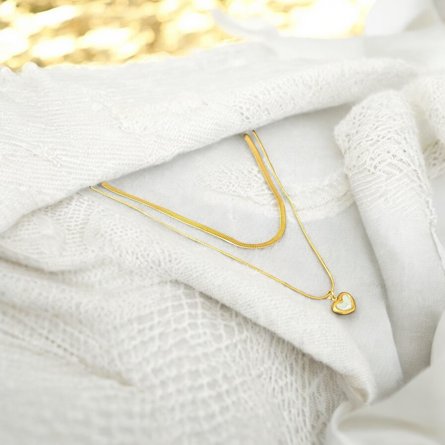 Layered Snake Chain Heart Pendant – Gold layered heart necklace for women, elegant jewelry.