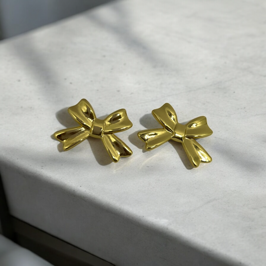 Gold-tone Solid Bow Earrings for women – elegant and versatile jewelry from The Velvet Vanity.