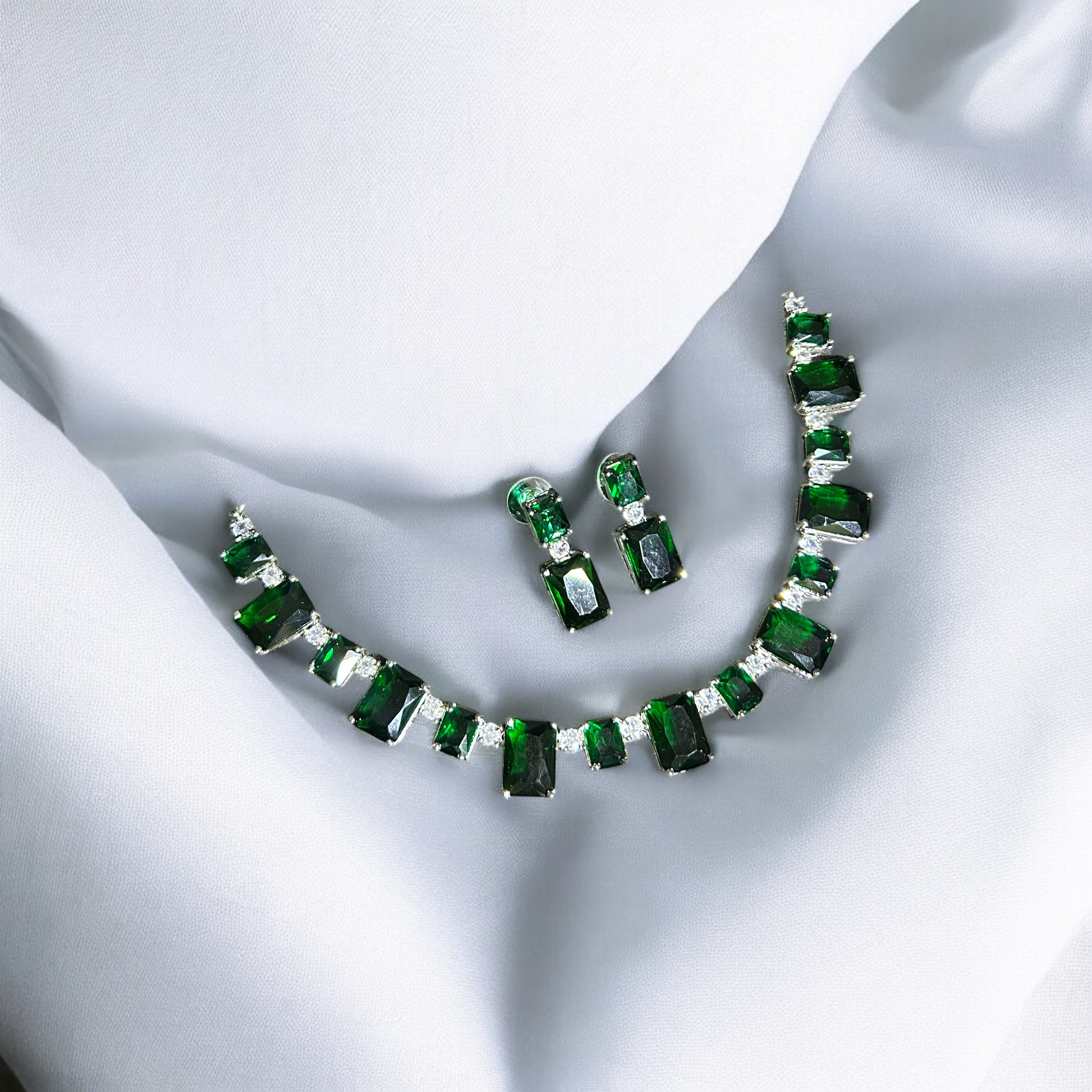 Samaira Emerald Necklace Set with green gemstones, elegant jewelry piece for formal occasions.